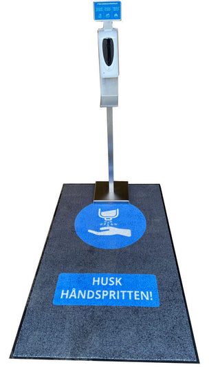 Smudsmåtte med teksten Vask hænder