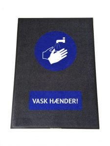 Smudsmåtte med teksten Vask hænder